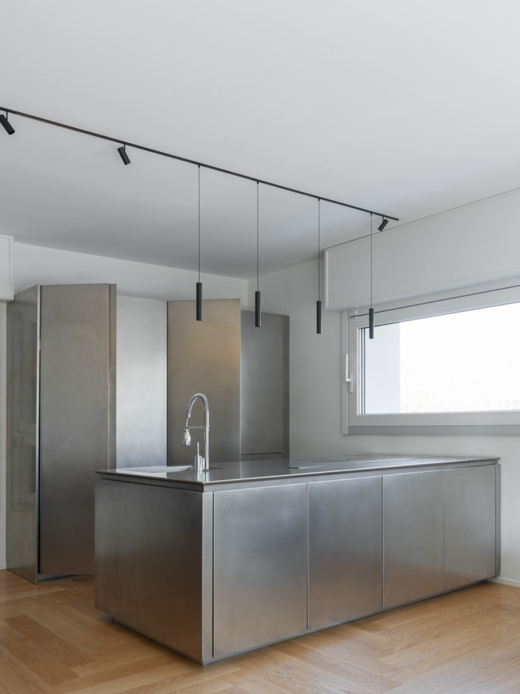 Design ideas for a mid-sized contemporary open plan kitchen in Milan.