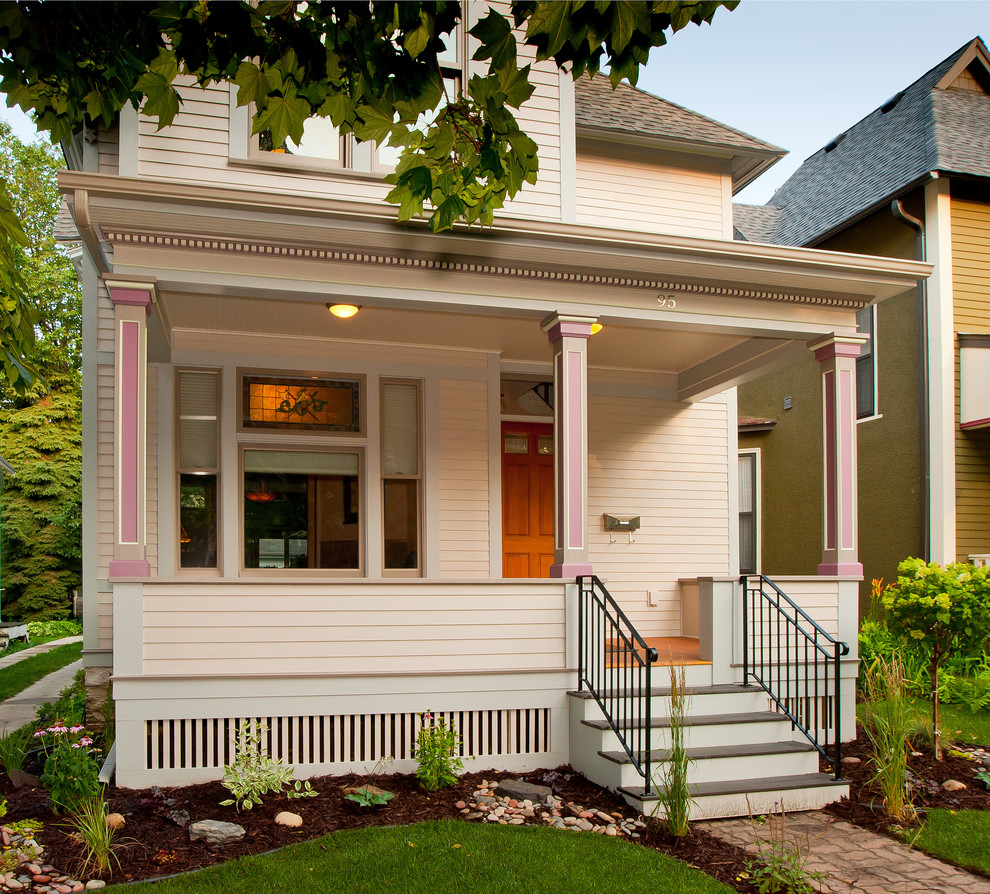This is an example of a victorian front porch design in Minneapolis.