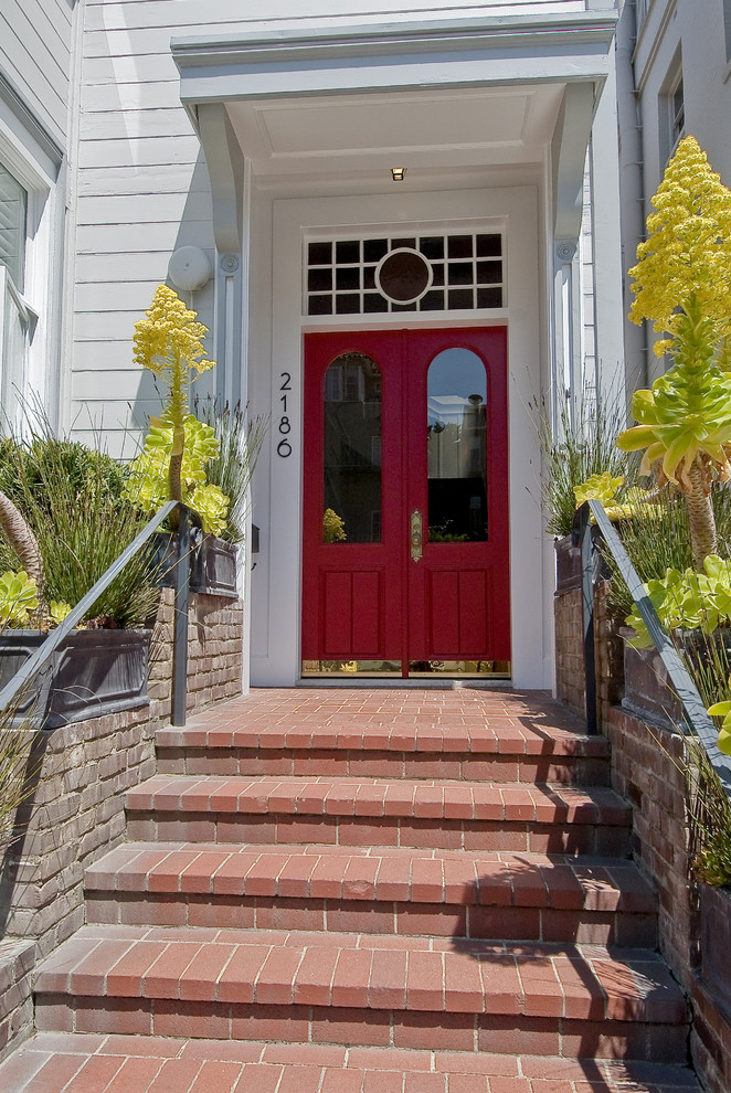 Photo of a traditional entryway in San Francisco with a red front door.
