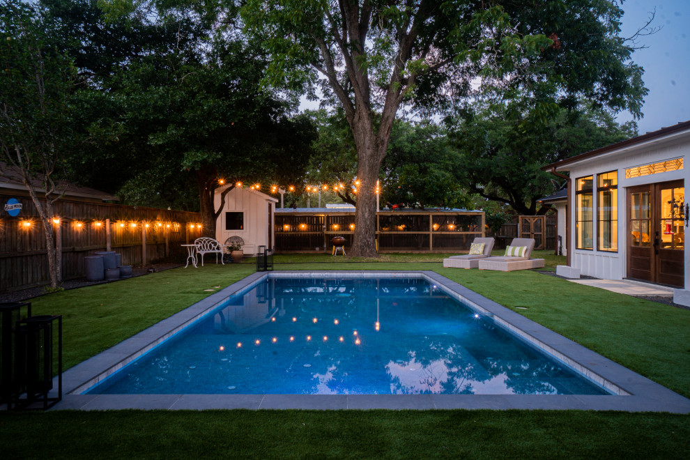 Photo of a mid-sized country backyard rectangular pool in Houston.