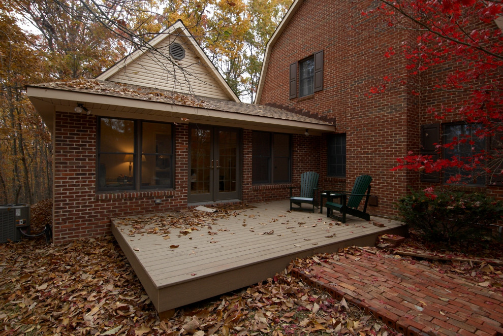Mid-sized backyard deck photo with no cover
