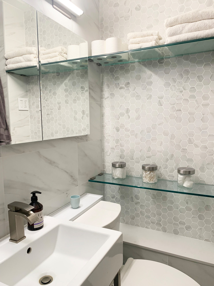 Design ideas for a small contemporary master bathroom in New York with open cabinets, white cabinets, a curbless shower, a one-piece toilet, white tile, white walls, cement tiles, a pedestal sink, engineered quartz benchtops, white floor, a hinged shower door, yellow benchtops, a niche, a single vanity and a freestanding vanity.
