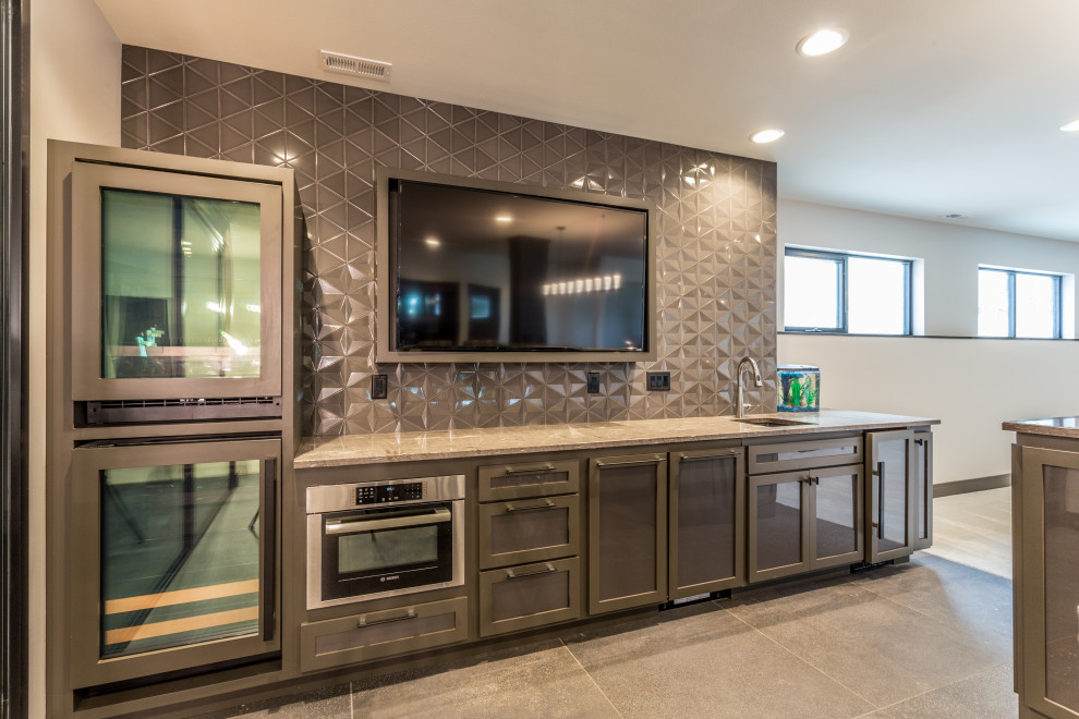 This is an example of a contemporary wet bar in Other with glass-front cabinets and grey cabinets.