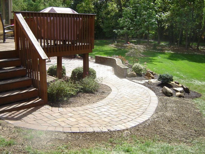 Design ideas for a large traditional backyard full sun garden in Indianapolis with a garden path and concrete pavers.