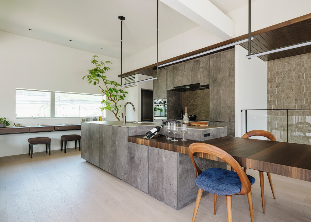 Inspiration for a modern galley open plan kitchen in Tokyo with a submerged sink, grey cabinets, laminate countertops, grey splashback, ceramic splashback, plywood flooring, an island, beige floors and grey worktops.