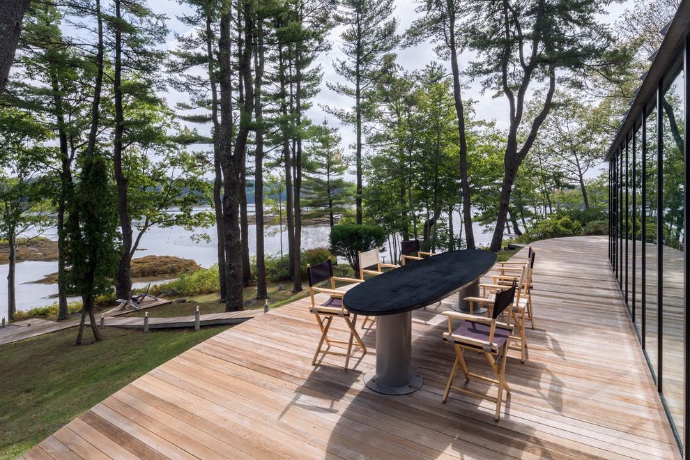 This is an example of a contemporary backyard deck in Boston with no cover.
