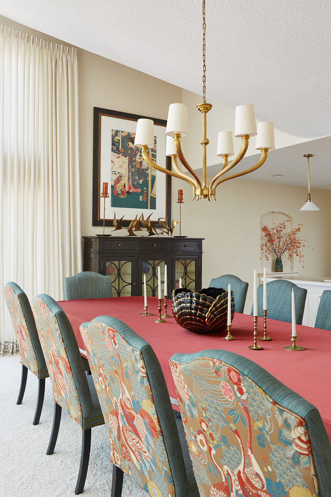 This is an example of a large eclectic dining room in Minneapolis with beige walls, carpet and no fireplace.