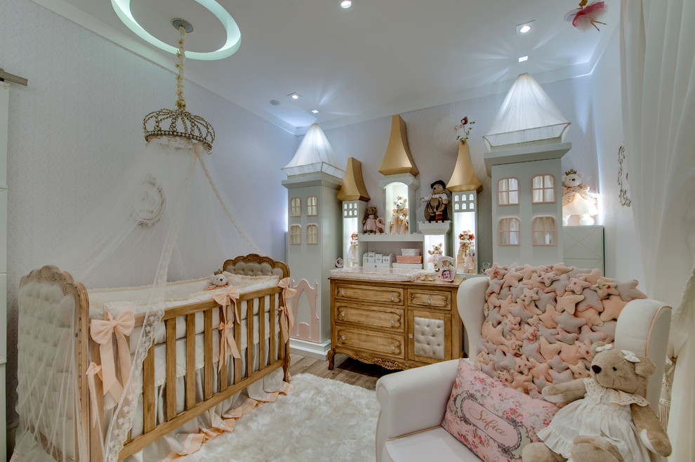 This is an example of a mid-sized traditional nursery in Other with vinyl floors and multi-coloured walls.