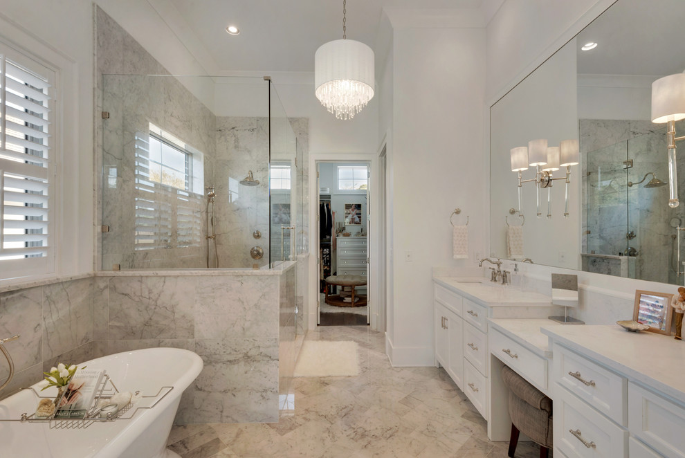 Photo of a contemporary bathroom in Miami with a freestanding tub, an open shower, beige tile, marble, marble floors and a drop-in sink.