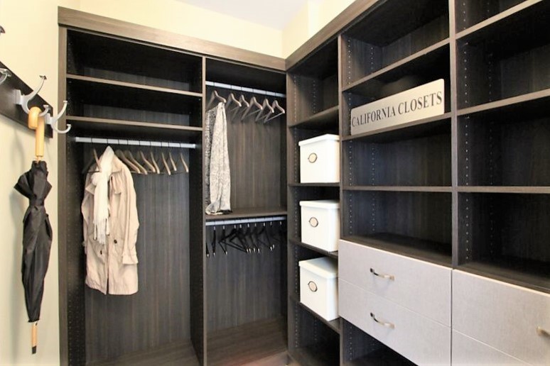 Inspiration for a small transitional gender-neutral walk-in wardrobe in Detroit with open cabinets and brown cabinets.