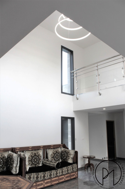 Conception architecturale d'une maison modern-vardagsrum
