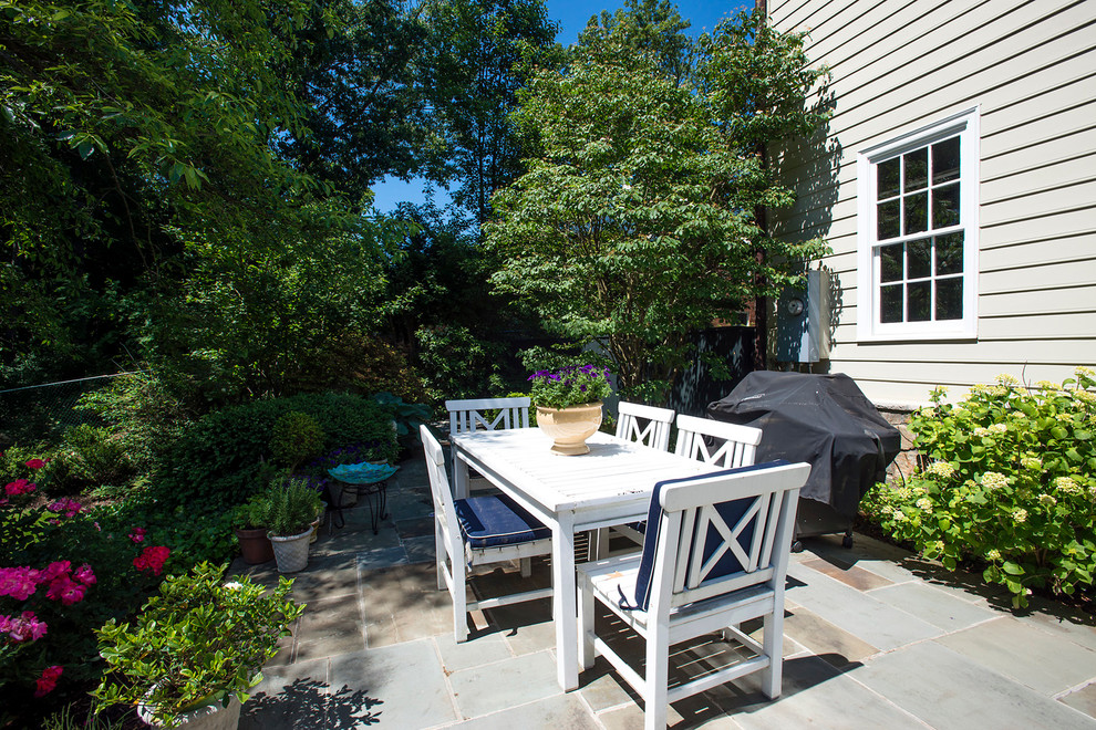 This is an example of a traditional backyard patio in DC Metro with natural stone pavers.