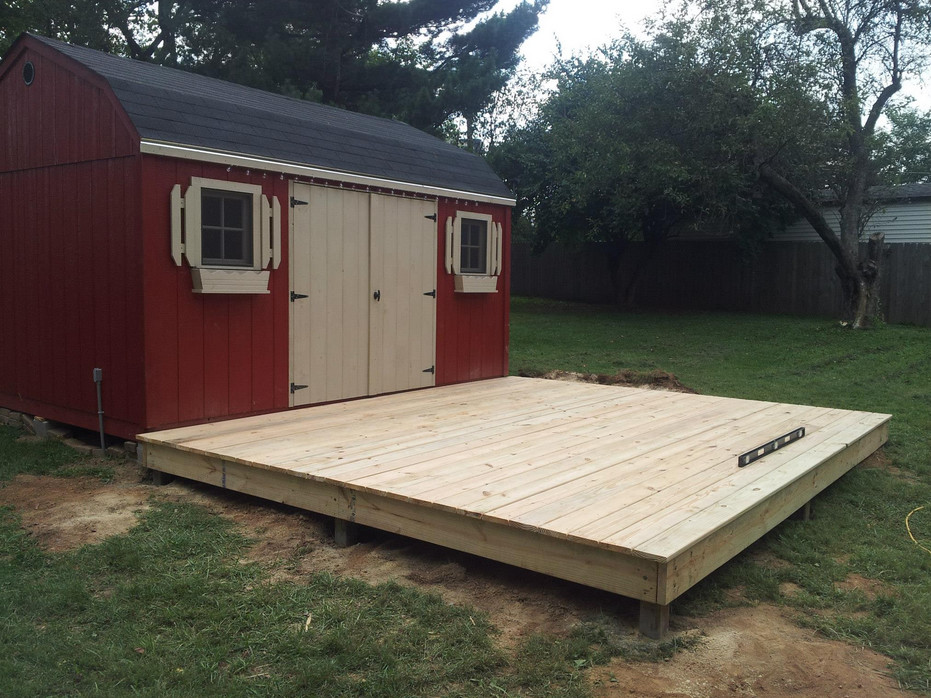 Example of a mid-sized backyard deck design with no cover
