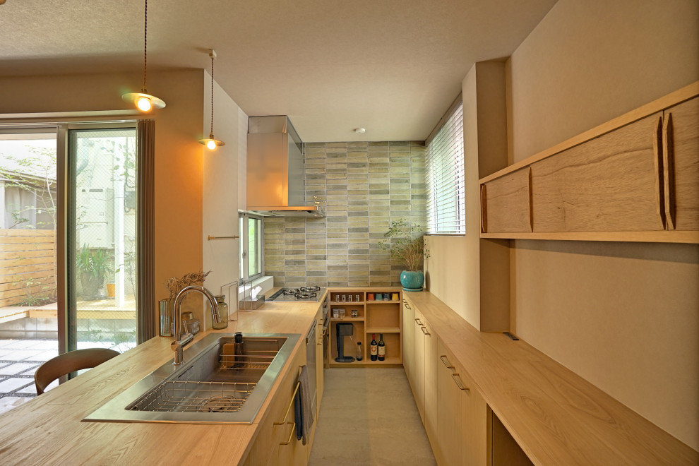 Inspiration for a small scandinavian galley concrete floor, gray floor and wallpaper ceiling eat-in kitchen remodel in Tokyo with a drop-in sink, flat-panel cabinets, medium tone wood cabinets, wood countertops, gray backsplash, stainless steel appliances, a peninsula and beige countertops