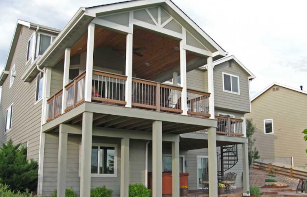 Example of a large classic gray two-story wood gable roof design in Denver