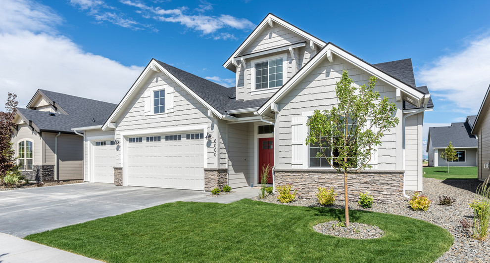 This is an example of a large split-level grey exterior in Boise.