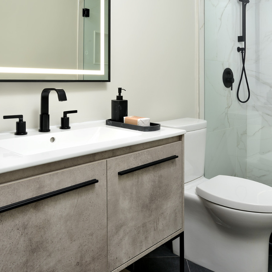 This is an example of a mid-sized transitional 3/4 bathroom in Toronto with flat-panel cabinets, distressed cabinets, a double shower, a two-piece toilet, black and white tile, porcelain tile, white walls, porcelain floors, an integrated sink, engineered quartz benchtops, black floor, a sliding shower screen, turquoise benchtops, a niche, a single vanity and a freestanding vanity.