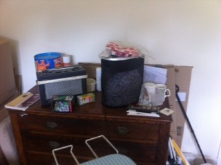 Decluttered reception room used as a storage room