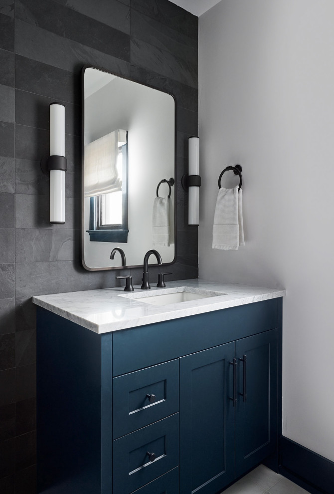 Photo of a mid-sized transitional bathroom in Chicago with shaker cabinets, blue cabinets, an alcove shower, gray tile, slate, white walls, marble floors, marble benchtops, grey floor, a hinged shower door, white benchtops, a single vanity and a built-in vanity.