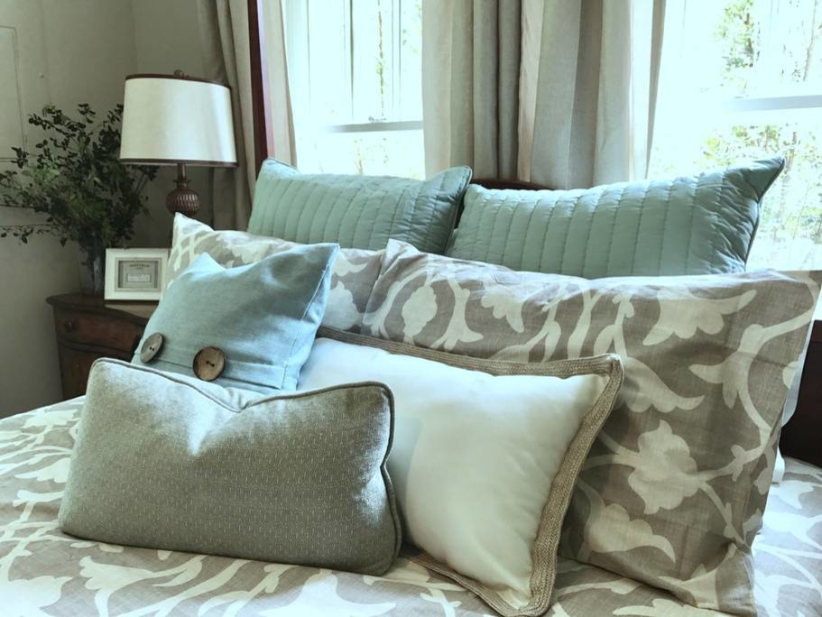 Mid-sized country master bedroom in Atlanta with beige walls, dark hardwood floors and brown floor.