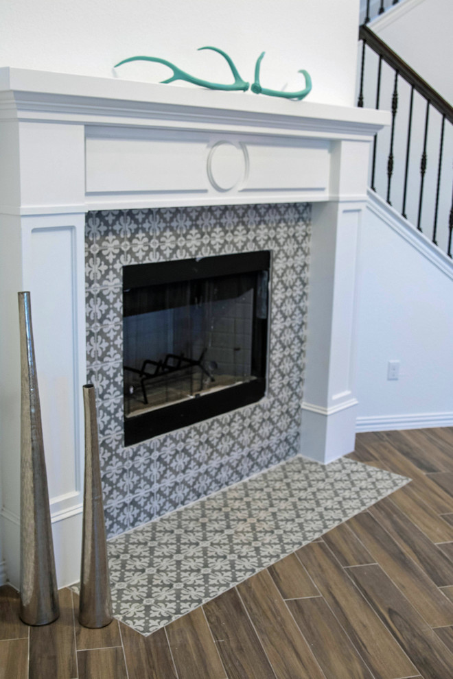 Photo of a mid-sized traditional open concept family room in Austin with porcelain floors, a corner fireplace and a tile fireplace surround.