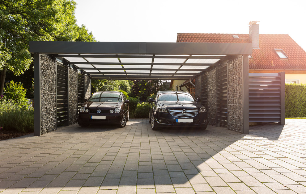 Large contemporary detached two-car carport in Other.