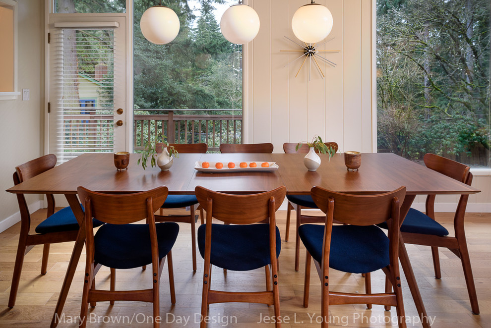Mid-sized midcentury dining room in Seattle with beige walls, light hardwood floors and no fireplace.