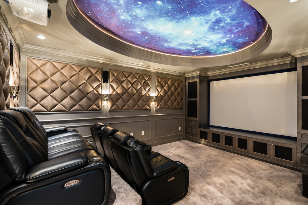 Design ideas for a large traditional enclosed home theatre in Vancouver with grey walls, carpet, a projector screen and grey floor.