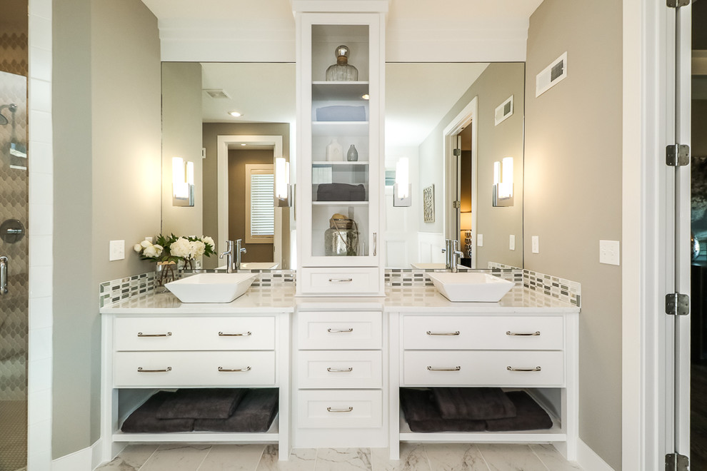 Inspiration for a transitional bathroom in Kansas City with shaker cabinets, white cabinets, grey walls and a vessel sink.