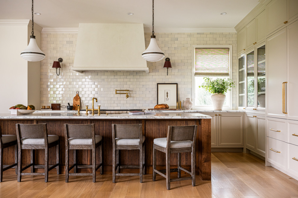 Inspiration for a mid-sized transitional l-shaped light wood floor eat-in kitchen remodel in Dallas with a farmhouse sink, dark wood cabinets, marble countertops, multicolored backsplash, ceramic backsplash, an island and white countertops