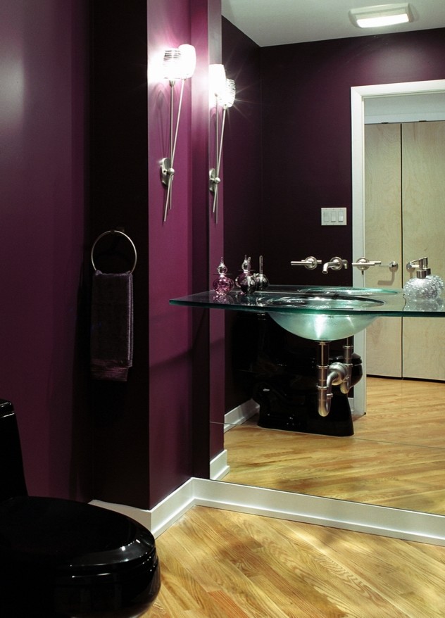 Inspiration for a small contemporary light wood floor powder room remodel in Other with a wall-mount sink, a two-piece toilet and purple walls