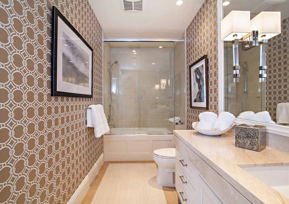 Alcove bathtub - huge transitional white tile porcelain tile alcove bathtub idea in Miami with shaker cabinets, white cabinets, a one-piece toilet, brown walls, an undermount sink and marble countertops