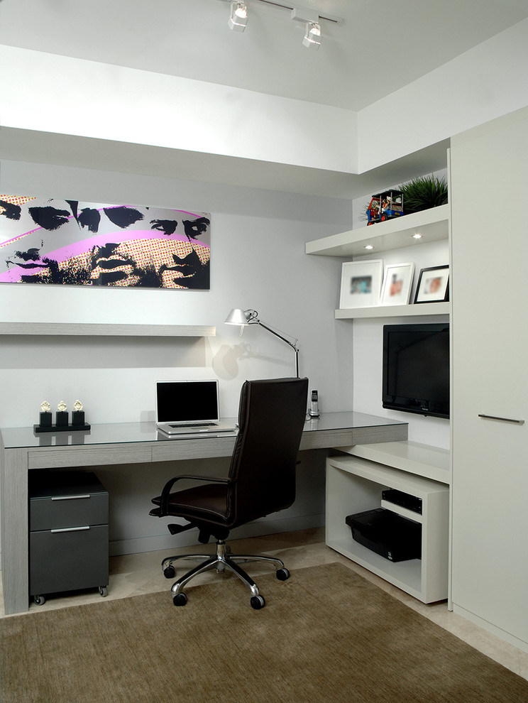 Photo of a contemporary home office in Miami with grey walls and a built-in desk.