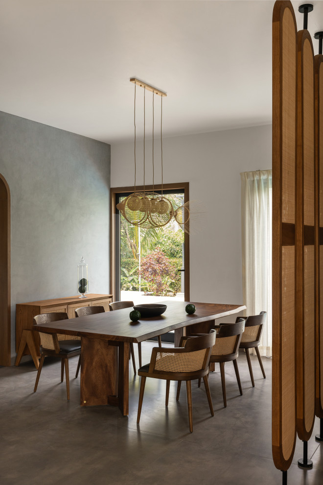 Design ideas for a contemporary dining room in Kolkata.
