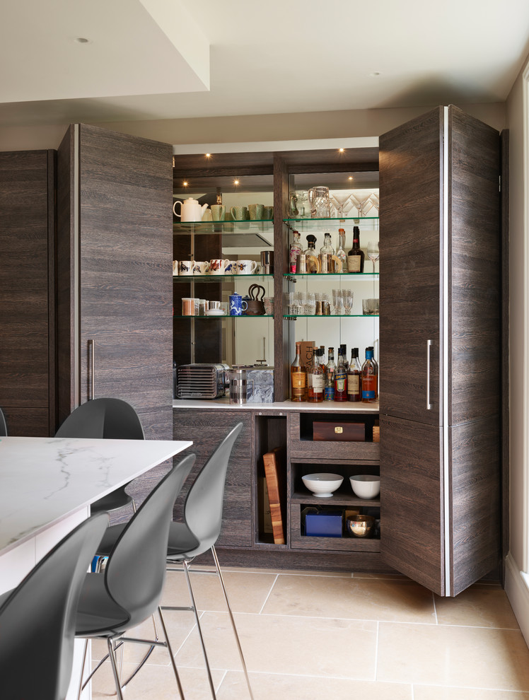 Design ideas for a small contemporary single-wall home bar in Berkshire with no sink, flat-panel cabinets, dark wood cabinets, mirror splashback, beige floor and white benchtop.
