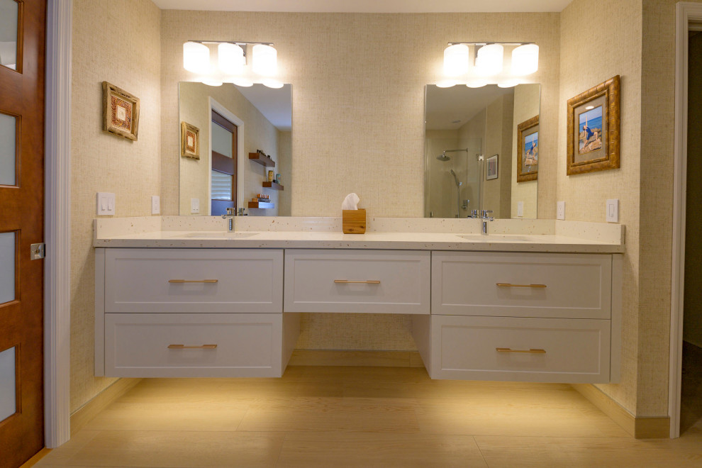 Mid-sized modern master bathroom in Other with white cabinets, a curbless shower, a bidet, beige tile, porcelain tile, beige walls, wood-look tile, an undermount sink, engineered quartz benchtops, beige floor, a hinged shower door, beige benchtops, a double vanity, a floating vanity and wallpaper.