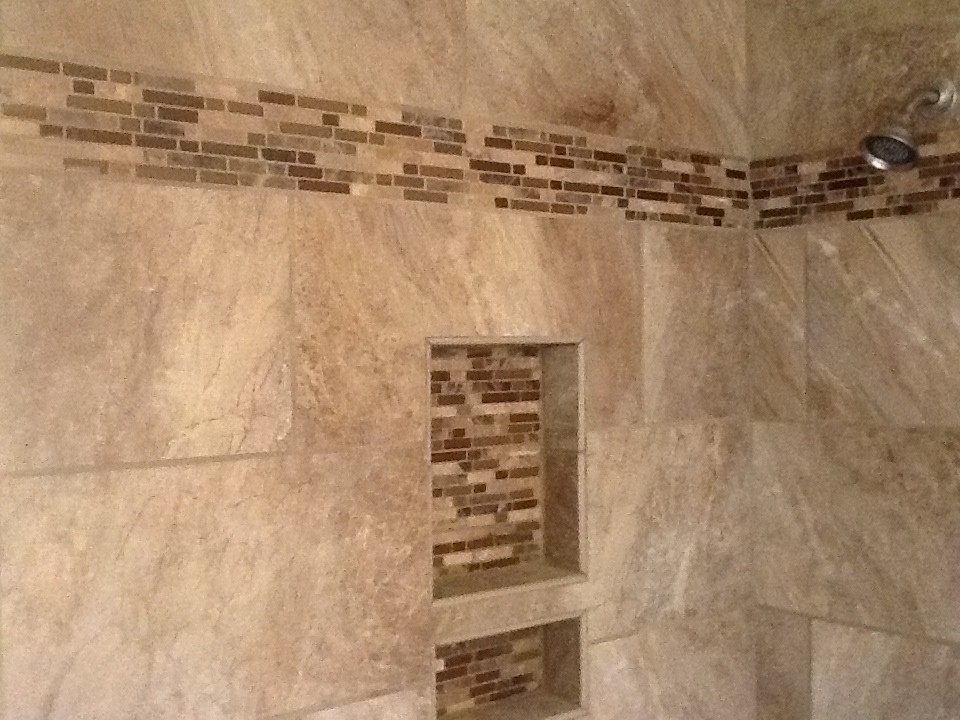 Inspiration for a bathroom in Austin with an alcove tub, an alcove shower and beige tile.