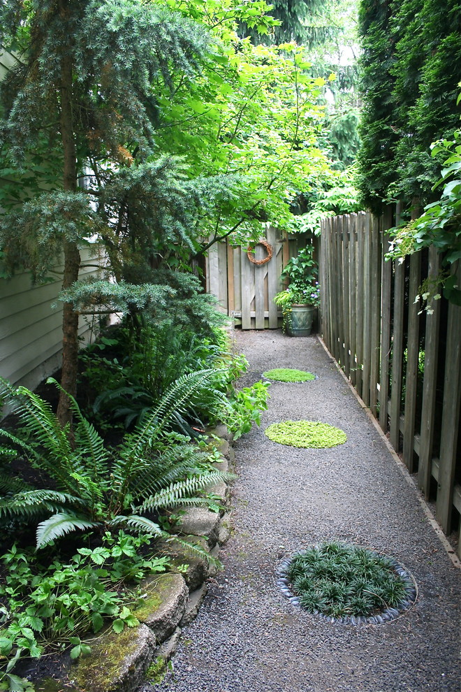 Photo of a traditional side yard garden in Portland.