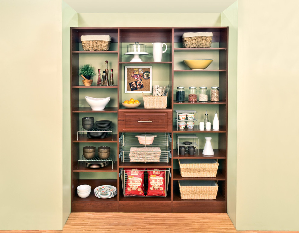 Example of a small transitional single-wall light wood floor and beige floor kitchen pantry design with raised-panel cabinets and medium tone wood cabinets