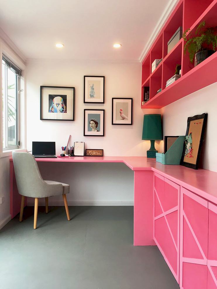 Mid-sized eclectic home office in Melbourne with a built-in desk.