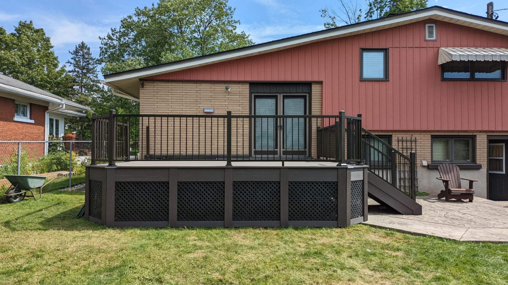 Photo of a medium sized modern back metal railing terrace in Ottawa with skirting.