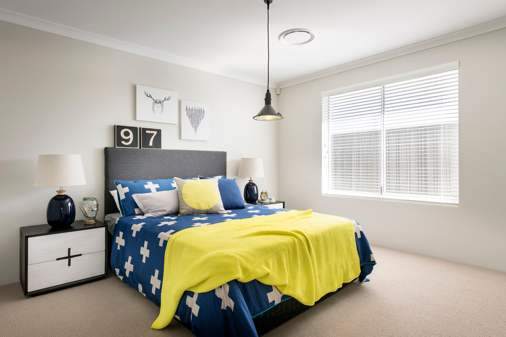 Design ideas for a mid-sized beach style bedroom in Perth with beige walls, carpet and no fireplace.