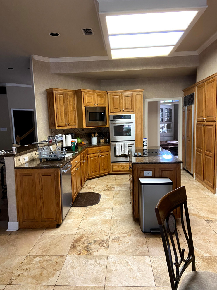 Example of a transitional u-shaped porcelain tile and beige floor kitchen pantry design with an island