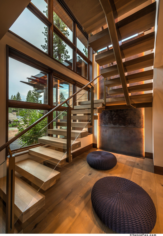 Photo of a contemporary wood floating staircase in Sacramento with open risers.