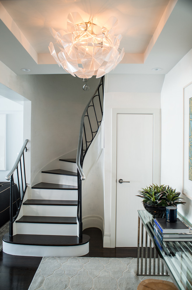 Inspiration for a small contemporary foyer in New York with white walls and dark hardwood floors.