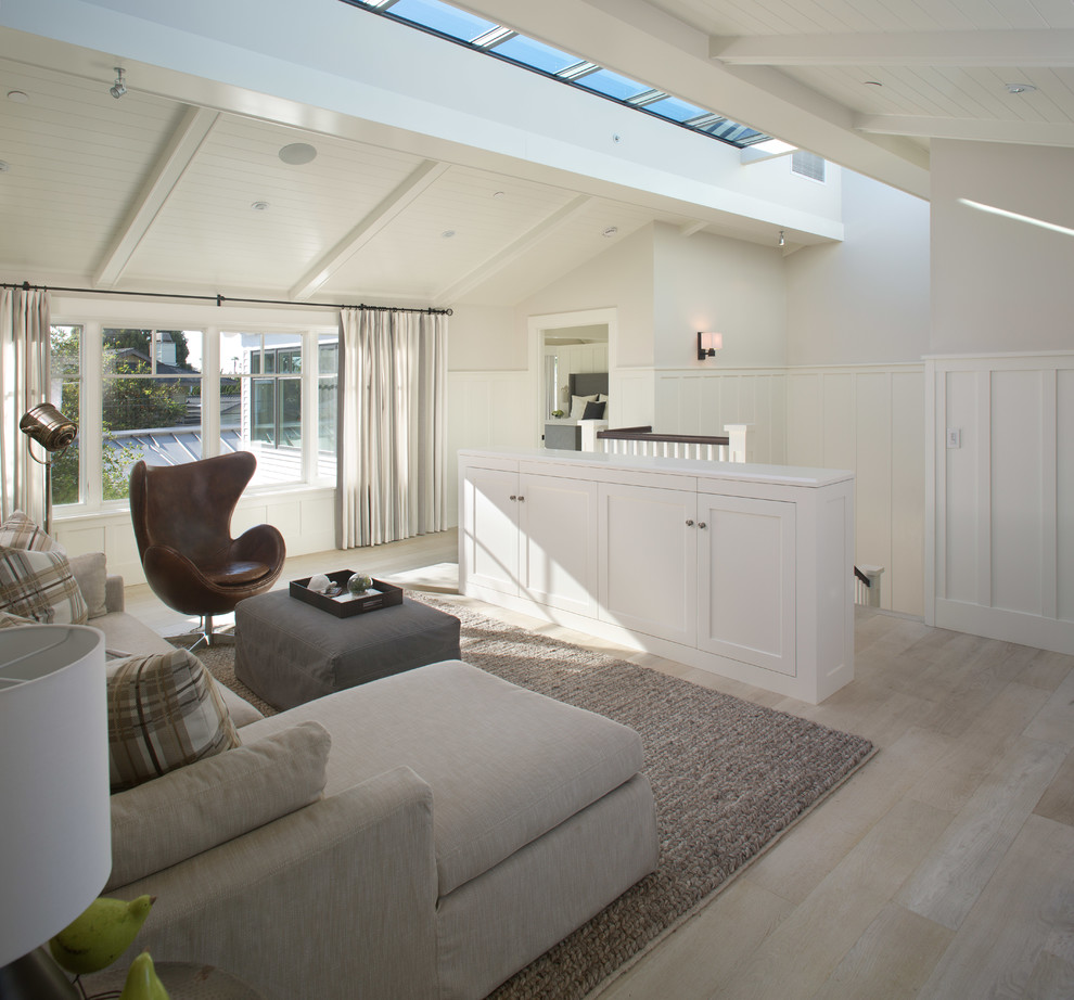 Transitional loft-style light wood floor living room photo in San Diego with white walls, no fireplace and no tv