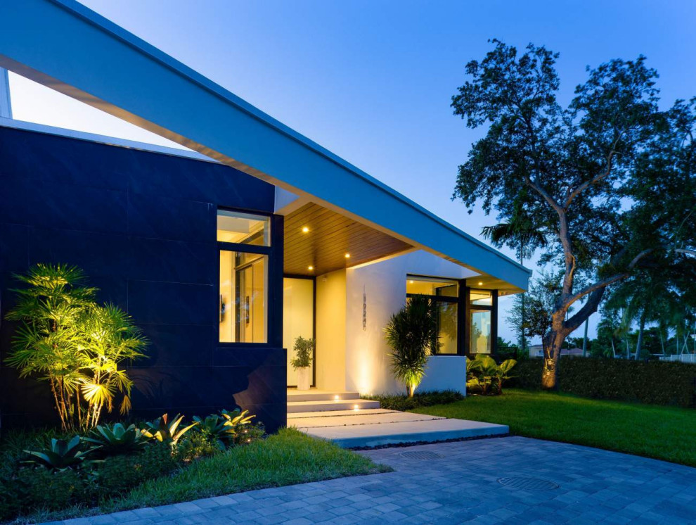 Example of a trendy home design design in Miami