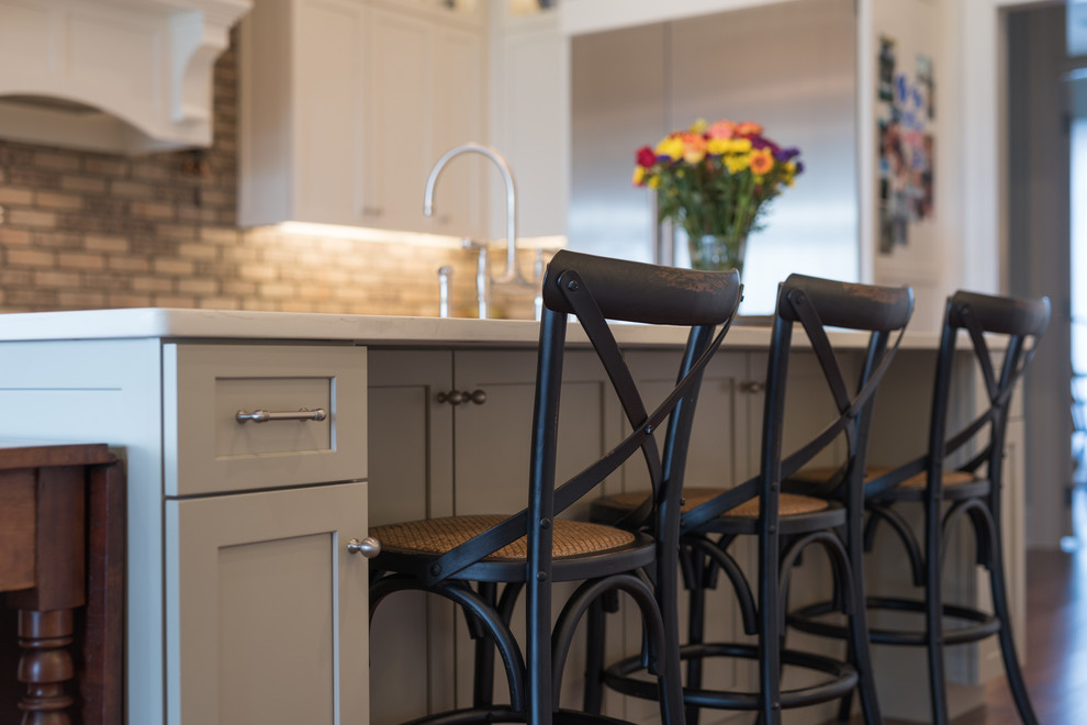 Example of a large transitional home design design