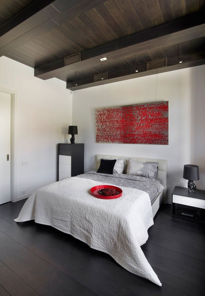 Inspiration for a contemporary bedroom in Lyon with white walls and dark hardwood floors.