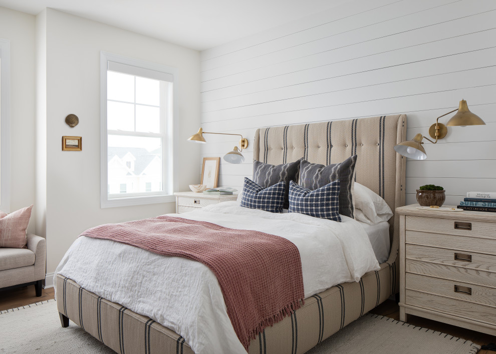 Design ideas for a beach style guest bedroom in Other with white walls and planked wall panelling.